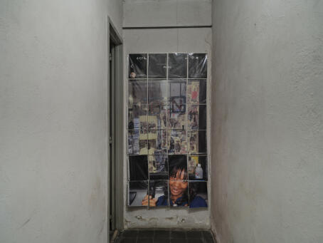 Allen-Golder Carpenter - Untitled (shame wall) - 2021-2024 - Ink jet prints on copy paper, plastic document sleeves, tape - 167.64 x 86.36 cm