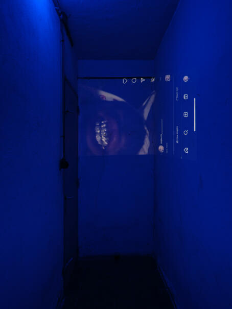 Allen-Golder Carpenter - Free jah morant , 2025 Urine test cups, ash, projector, moving image, gemstones, urine. Spatial installation. Dimensions variable - TICK TACK