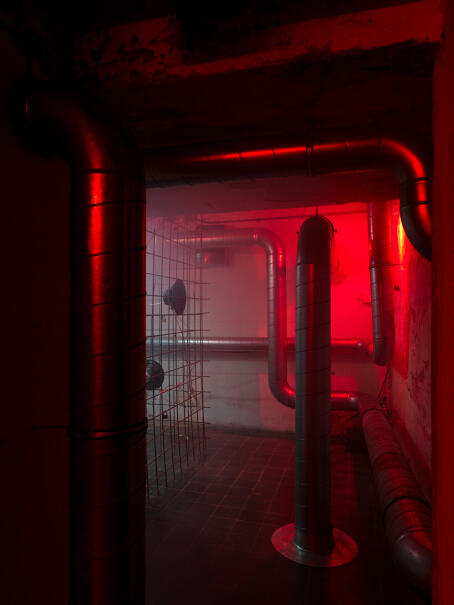 Hannah Perry, BPM (Thrash), 2026, air vent tubing, 12 subwoofers, rebar caging, padlocks, sound piece 8 min 10 sec, 245 x 180 x 180 cm