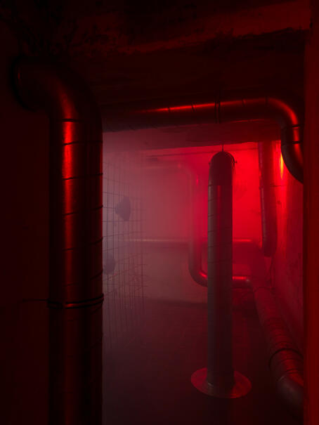 Hannah Perry, BPM (Thrash), 2026, air vent tubing, 12 subwoofers, rebar caging, padlocks, sound piece 8 min 10 sec, 245 x 180 x 180 cm
