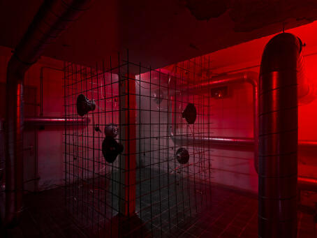 Hannah Perry, BPM (Thrash), 2026, air vent tubing, 12 subwoofers, rebar caging, padlocks, sound piece 8 min 10 sec, 245 x 180 x 180 cm