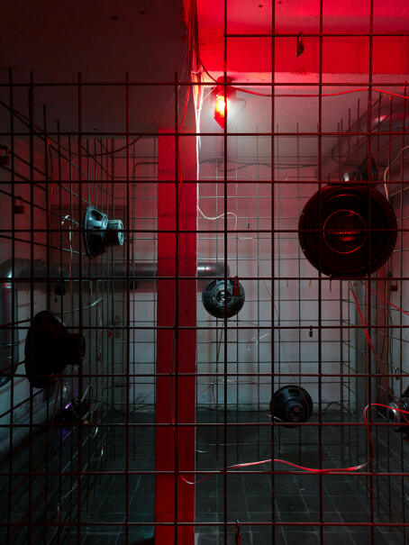 Hannah Perry, BPM (Thrash), 2026, air vent tubing, 12 subwoofers, rebar caging, padlocks, sound piece 8 min 10 sec, 245 x 180 x 180 cm
