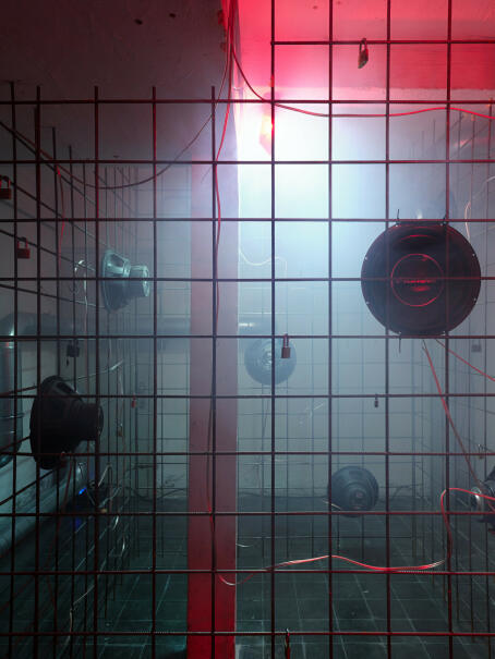 Hannah Perry, BPM (Thrash), 2026, air vent tubing, 12 subwoofers, rebar caging, padlocks, sound piece 8 min 10 sec, 245 x 180 x 180 cm