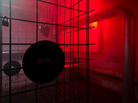 Hannah Perry, BPM (Thrash), 2026, air vent tubing, 12 subwoofers, rebar caging, padlocks, sound piece 8 min 10 sec, 245 x 180 x 180 cm