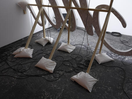 Banks Violette, Untitled (The End), 2026, mdf, aluminium, light bulbs, lacquer paint, wooden scaffold, electrical wiring, 206 x 310 cm