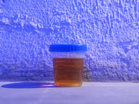 Allen-Golder Carpenter - Free jah morant , 2025 Urine test cups, ash, projector, moving image, gemstones, urine. Spatial installation. Dimensions variable - TICK TACK