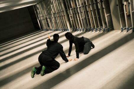 SCRUM, performance in depot by Lily White, dancers Mina Verheyen and Charlotte Dos Santos, Nothing New Under the Sun, TICK TACK, 2026. Photographer: Sammuel Nijhuis.